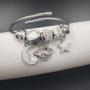 Imagem de Pulseira Bracelete Feminino Prateado Aço Inox Antialérgico Com Berloques Vários Modelos