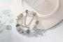 Imagem de Pulseira Prateada Com Berloques e Pedras