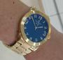 Imagem de Relogio Champion Feminino dourado grande mostrador azul com numeros CN26564A