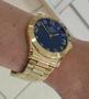 Imagem de Relogio Champion Feminino dourado grande mostrador azul com numeros CN26564A