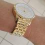 Imagem de Relogio Technos feminino grande dourado banhado aço inox  lado pedrinhas coloridas strass 2035NAF/1B
