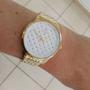 Imagem de Relogio Technos feminino grande dourado banhado aço inox  lado pedrinhas coloridas strass 2035NAF/1B